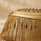 Close-up of fringe stitching and texture on Gold leather fringe belt bag
