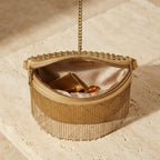 Interior lining and pockets of Gold leather fringe belt bag