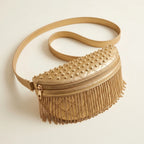 Gold leather fringe belt bag, three-quarter angle showing side depth