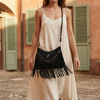 Woman wearing Black leather fringe messenger bag with swaying fringe
