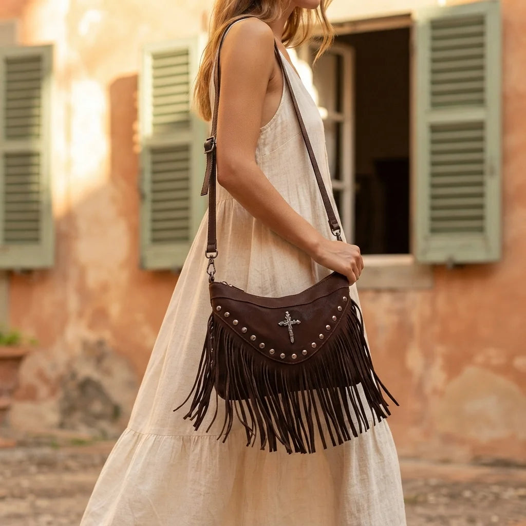 Woman wearing Brown leather fringe messenger bag with swaying fringe