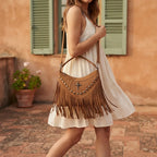 Woman wearing Coffee leather fringe messenger bag with swaying fringe