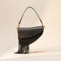 Black leather saddle bag fringe, front view