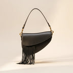 Black leather saddle bag fringe, front view