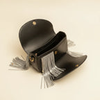 Interior lining and pockets of Black leather saddle bag fringe