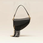 Black leather saddle bag fringe, three-quarter angle showing side depth