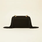 Back panel of Black long fringe clutch bag with strap attachments