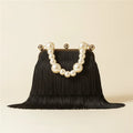 Black long fringe clutch bag, front view