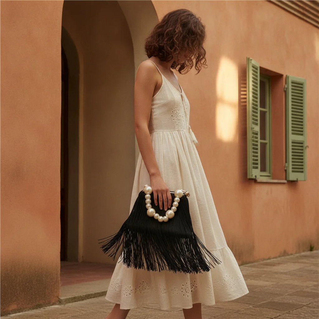 Woman wearing Black long fringe clutch bag with swaying fringe