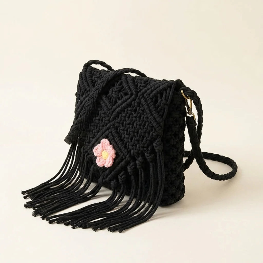 Black macrame fringe bag, three-quarter angle showing side depth