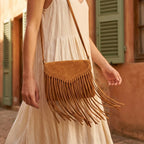 Woman wearing Brown mini fringe crossbody bag with swaying fringe