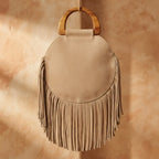 Back panel of Beige mini fringe shoulder bag with strap attachments