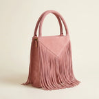 Pink mini fringe shoulder bag, three-quarter angle showing side depth