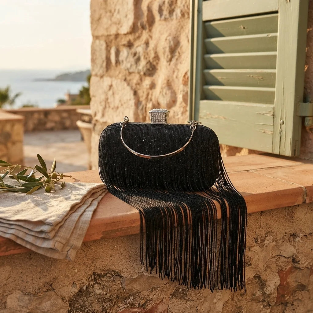 black fringe evening bag styled in a warm Mediterranean setting