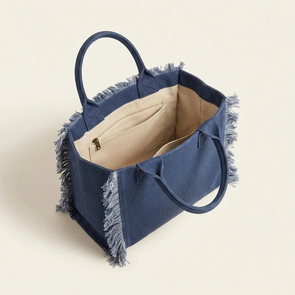 Interior lining and pockets of Navy oversized beach bag fringe