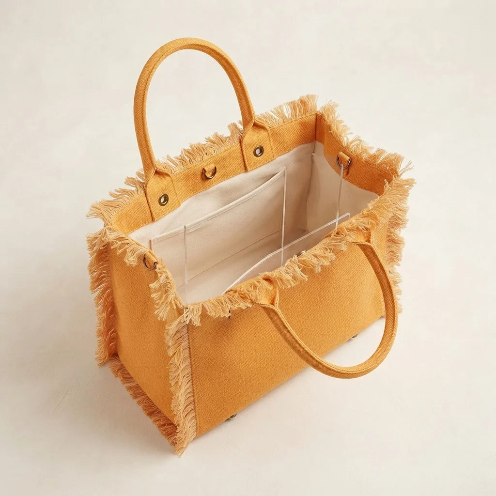 Interior lining and pockets of Orange oversized beach bag fringe