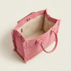 Interior lining and pockets of Pink oversized beach bag fringe