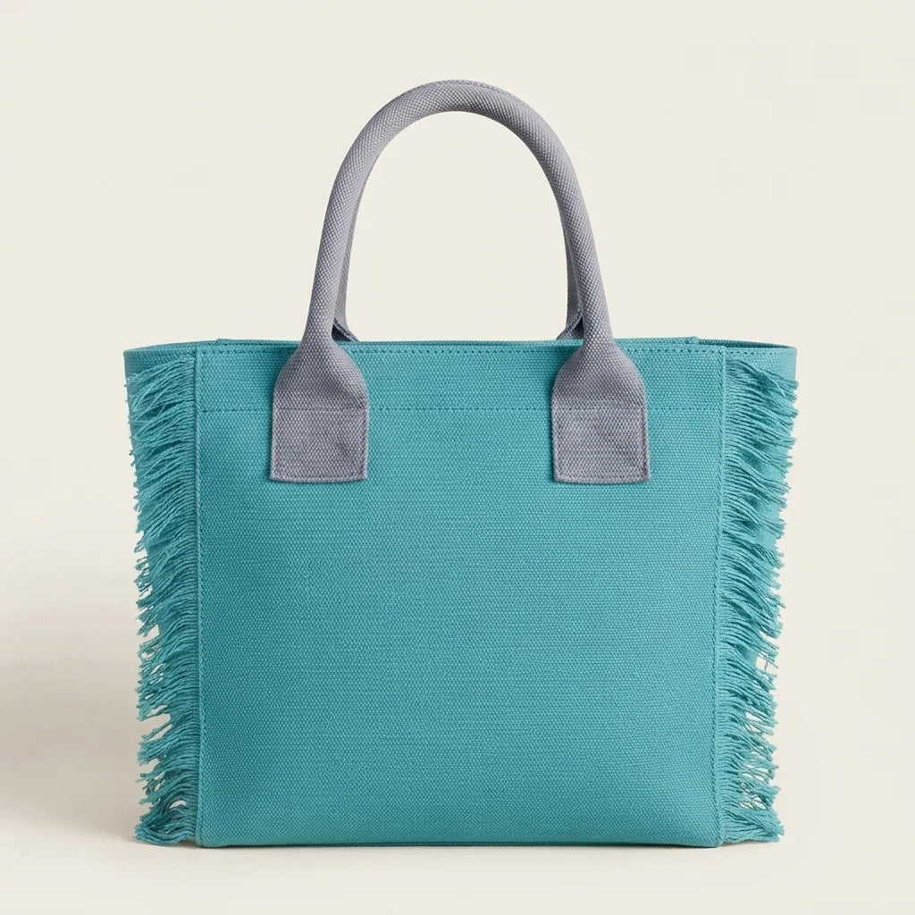 Back panel of Turquoise oversized beach bag fringe with strap attachments