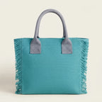 Back panel of Turquoise oversized beach bag fringe with strap attachments