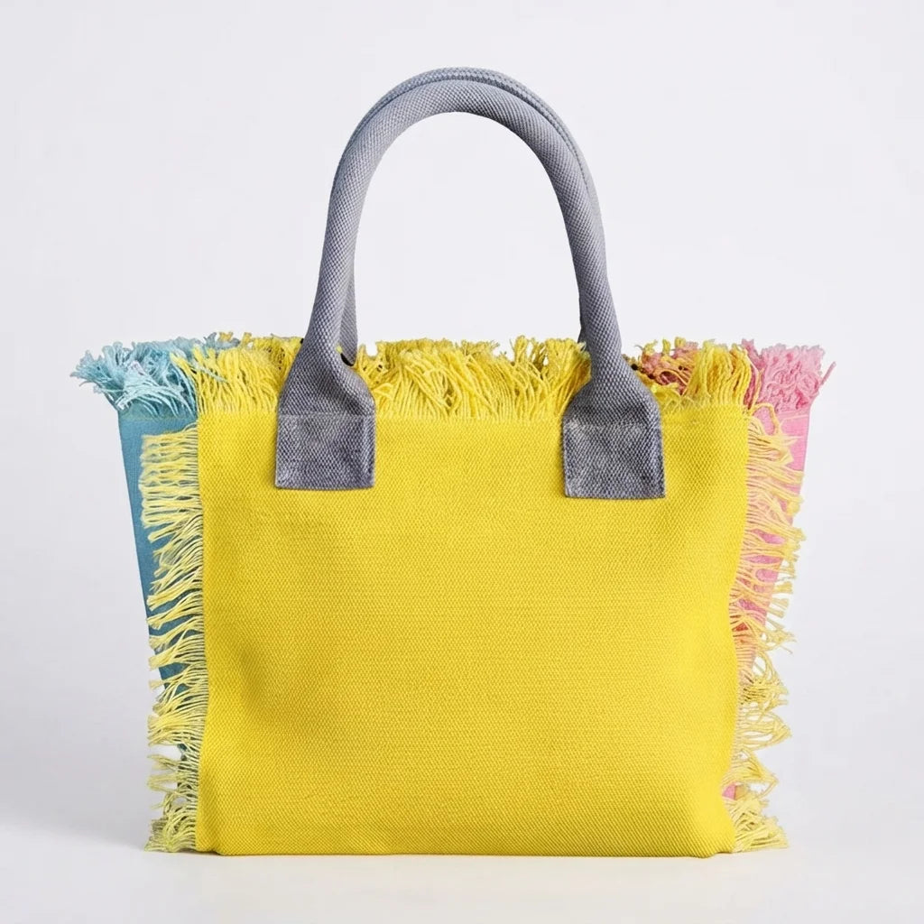 Yellow oversized beach bag fringe, three-quarter angle showing side depth