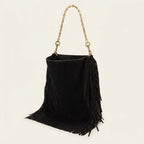Black oversized fringe bag, three-quarter angle showing side depth
