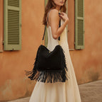 Woman wearing Black oversized fringe bag with swaying fringe