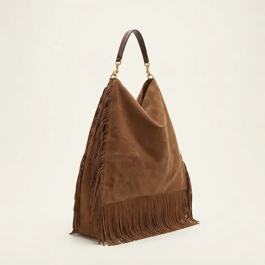 Brown oversized fringe bag, three-quarter angle showing side depth