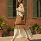 Woman wearing Brown oversized fringe bag with swaying fringe