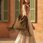 Woman wearing Coffee oversized fringe bag with swaying fringe