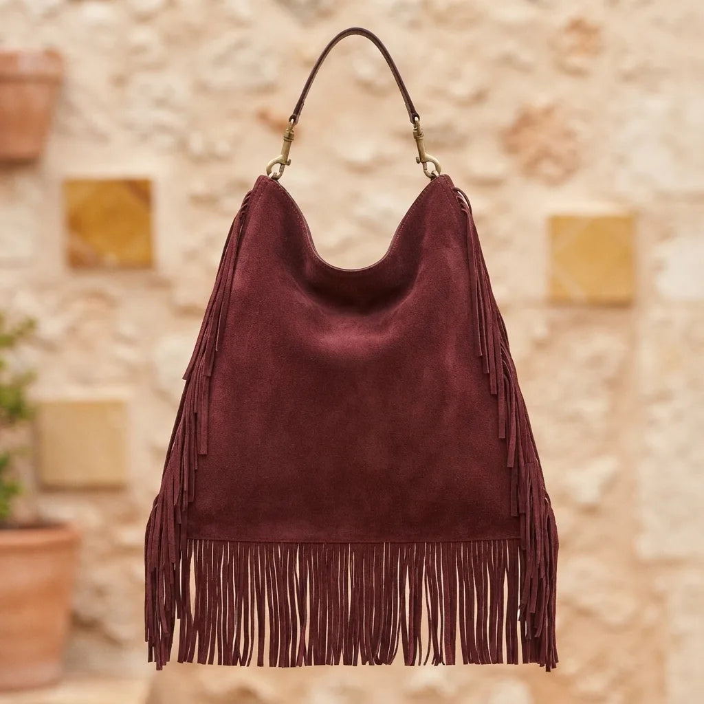 Back panel of Maroon oversized fringe bag with strap attachments