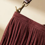 Close-up of fringe stitching and texture on Maroon oversized fringe bag