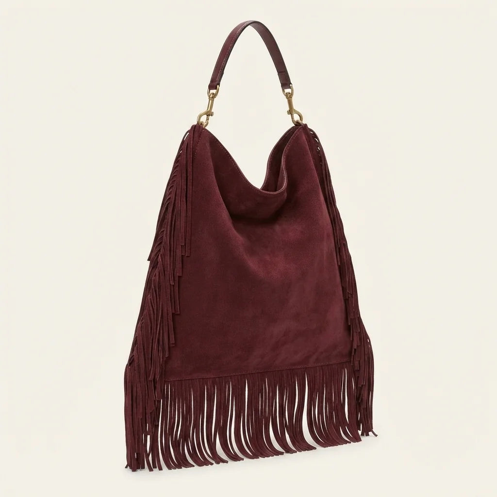 Maroon oversized fringe bag, three-quarter angle showing side depth