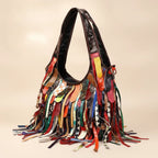 Multicolor oversized fringe leather hobo bag, three-quarter angle showing side depth
