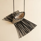 Interior lining and pockets of Black pearl fringe clutch bag