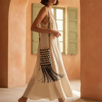 Woman wearing Black pearl fringe clutch bag with swaying fringe
