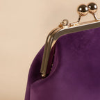 Close-up of fringe stitching and texture on Purple purple fringe clutch bag