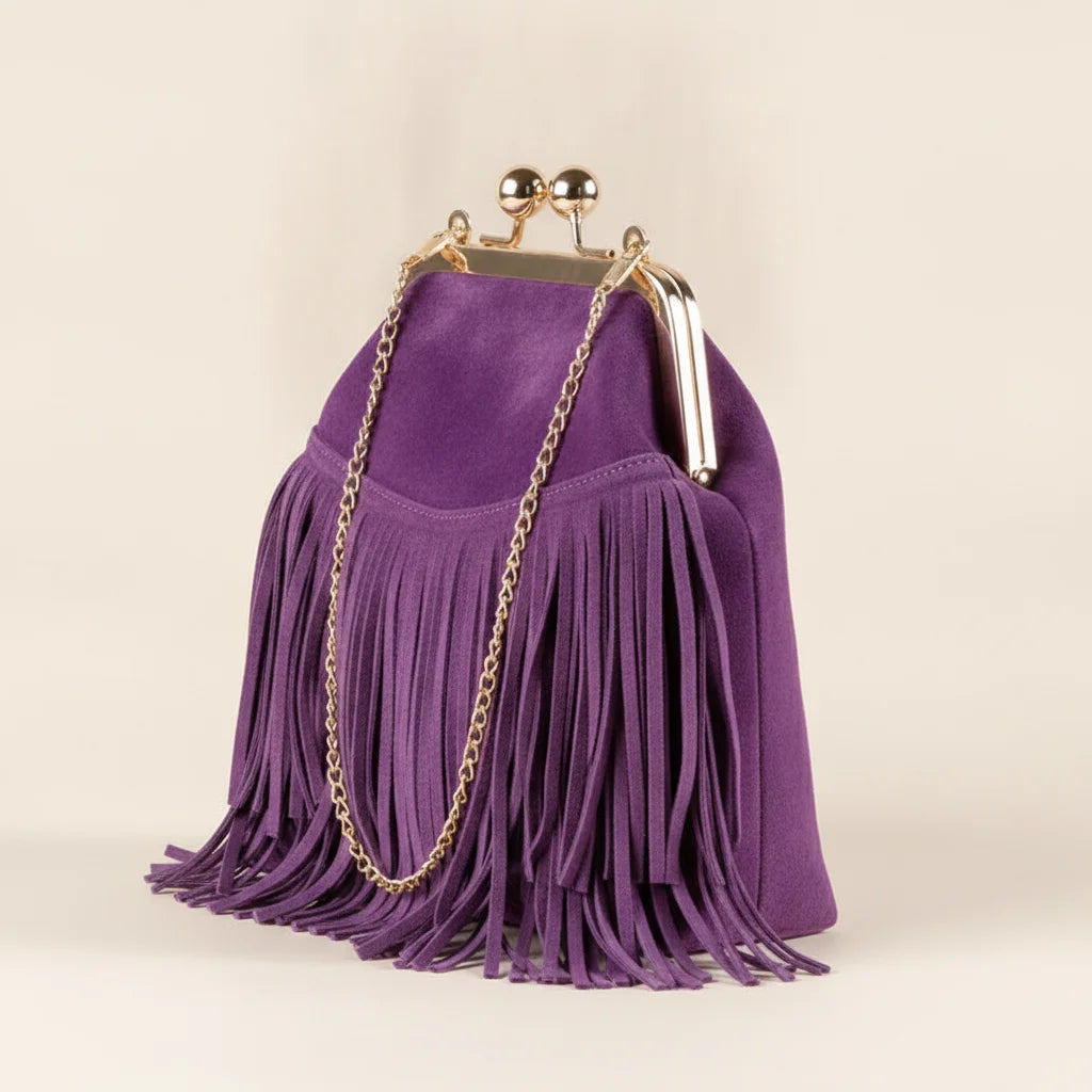 Purple purple fringe clutch bag, three-quarter angle showing side depth