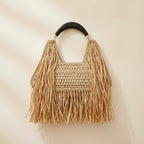 Back panel of Natural raffia fringe crescent bag with strap attachments