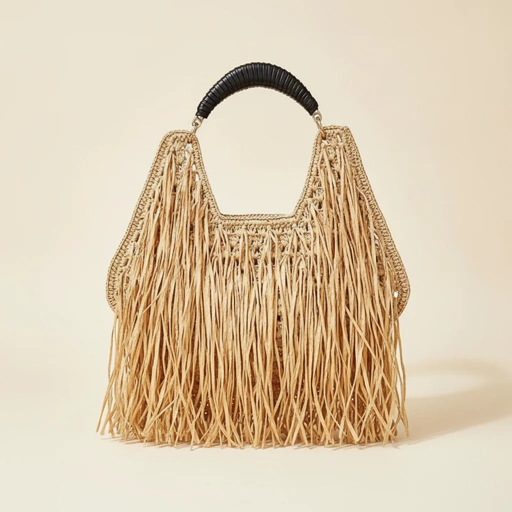 Natural raffia fringe crescent bag, front view