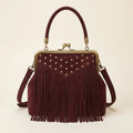 Burgundy red fringe clutch bag, front view