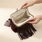 Interior lining and pockets of Burgundy red fringe clutch bag