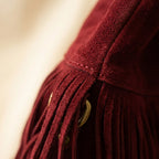 Close-up of fringe stitching and texture on Red red fringe crossbody bag