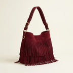 Red red fringe crossbody bag, three-quarter angle showing side depth