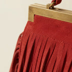Close-up of fringe stitching and texture on Red red fringe evening bag