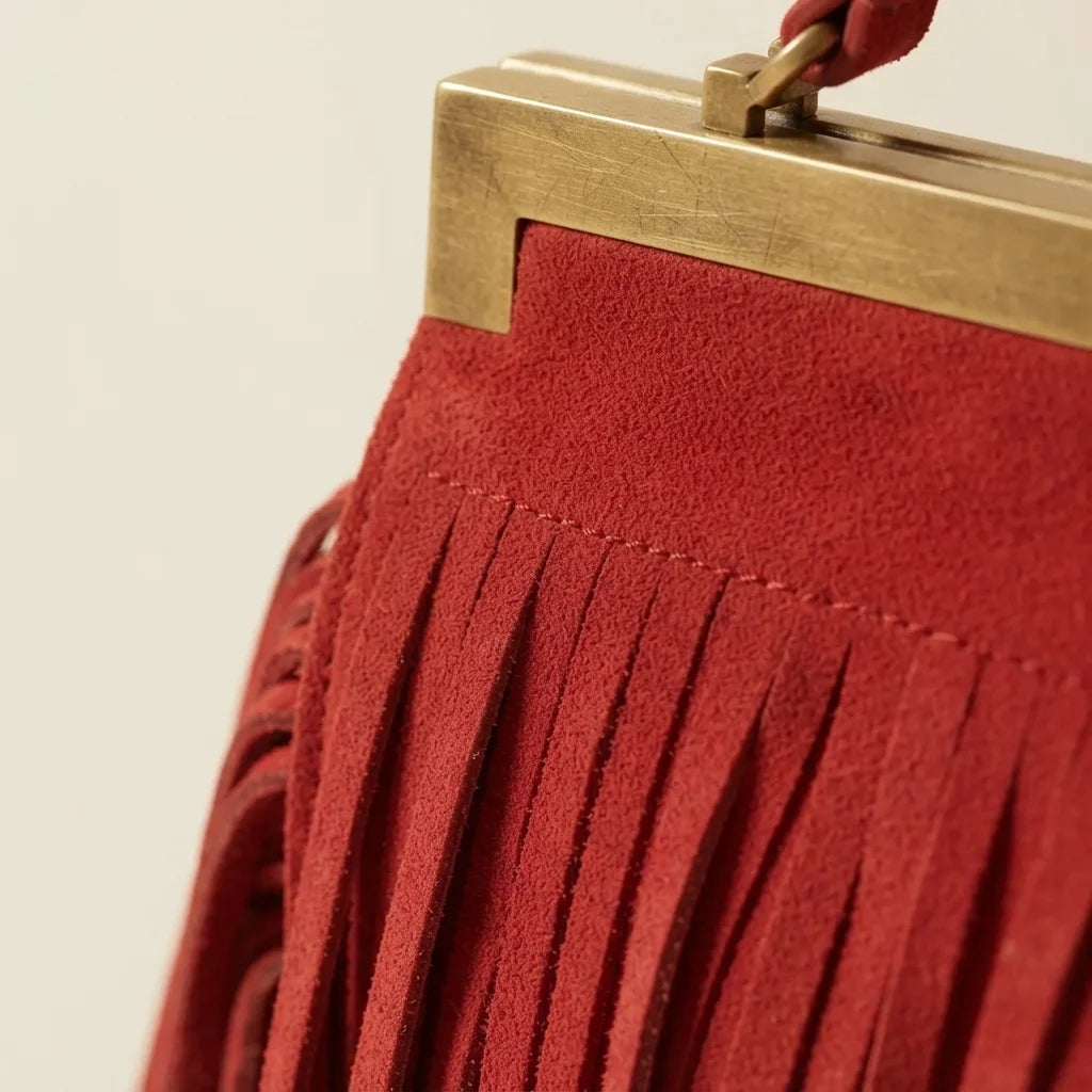 Close-up of fringe stitching and texture on Red red fringe evening bag