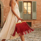 Woman wearing Red red fringe evening bag with swaying fringe