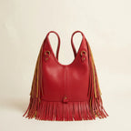 Back panel of Red red leather fringe bag with strap attachments
