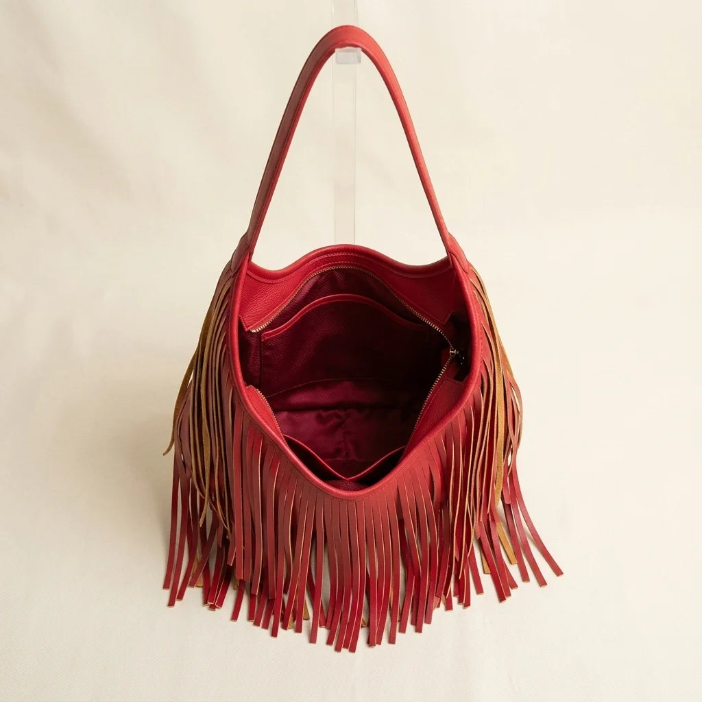 Interior lining and pockets of Red red leather fringe bag