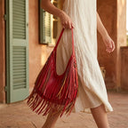 Woman wearing Red red leather fringe bag with swaying fringe