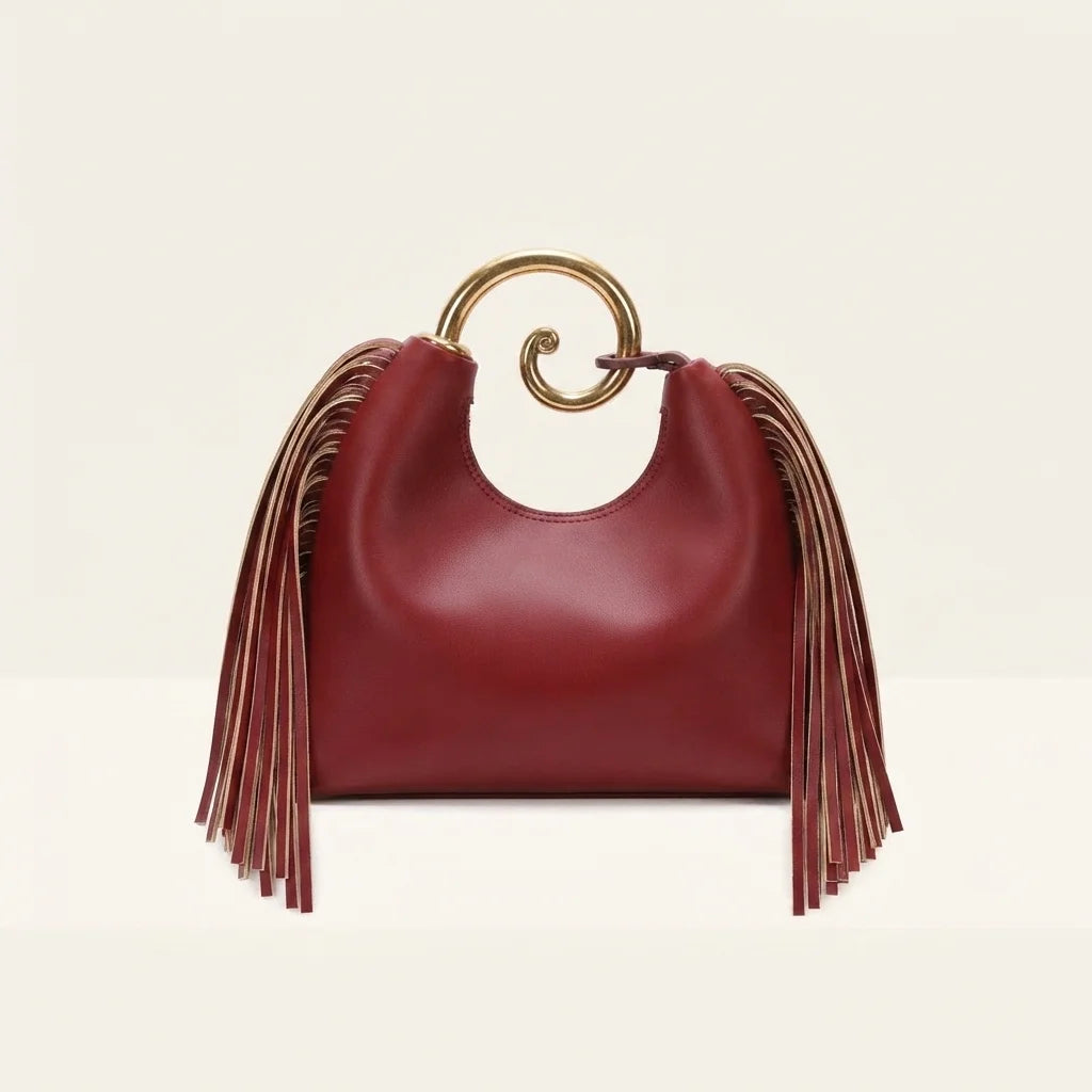 Back panel of Burgundy red leather fringe hobo bag with strap attachments